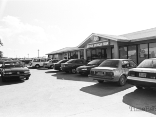 Cars in front of British American Bank