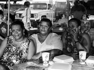 Three women at an outdoor table