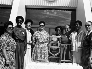 A group of women at the Legislative Assembly for the Education Centenary