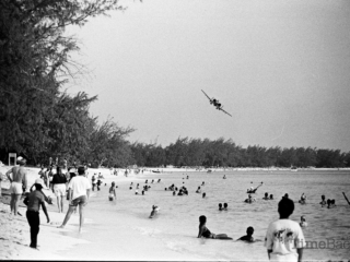 A plane above Seven Mile Beach