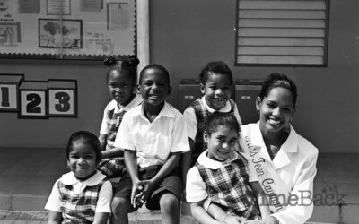 Miss Teen Cayman Islands with school children, 1999